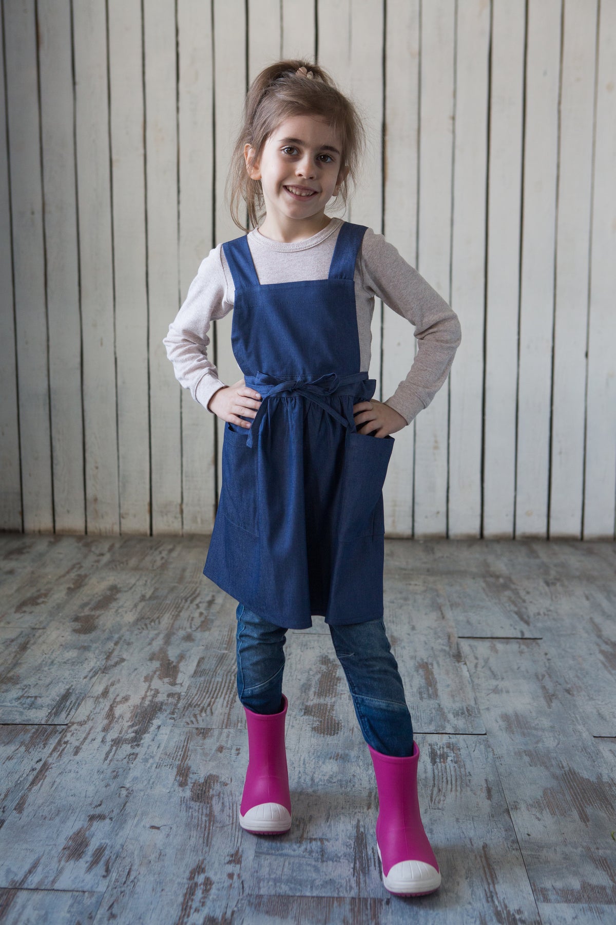 Denim apron dress, full length view