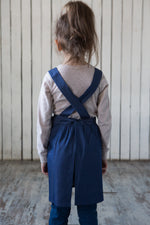 Denim cross back apron, back view