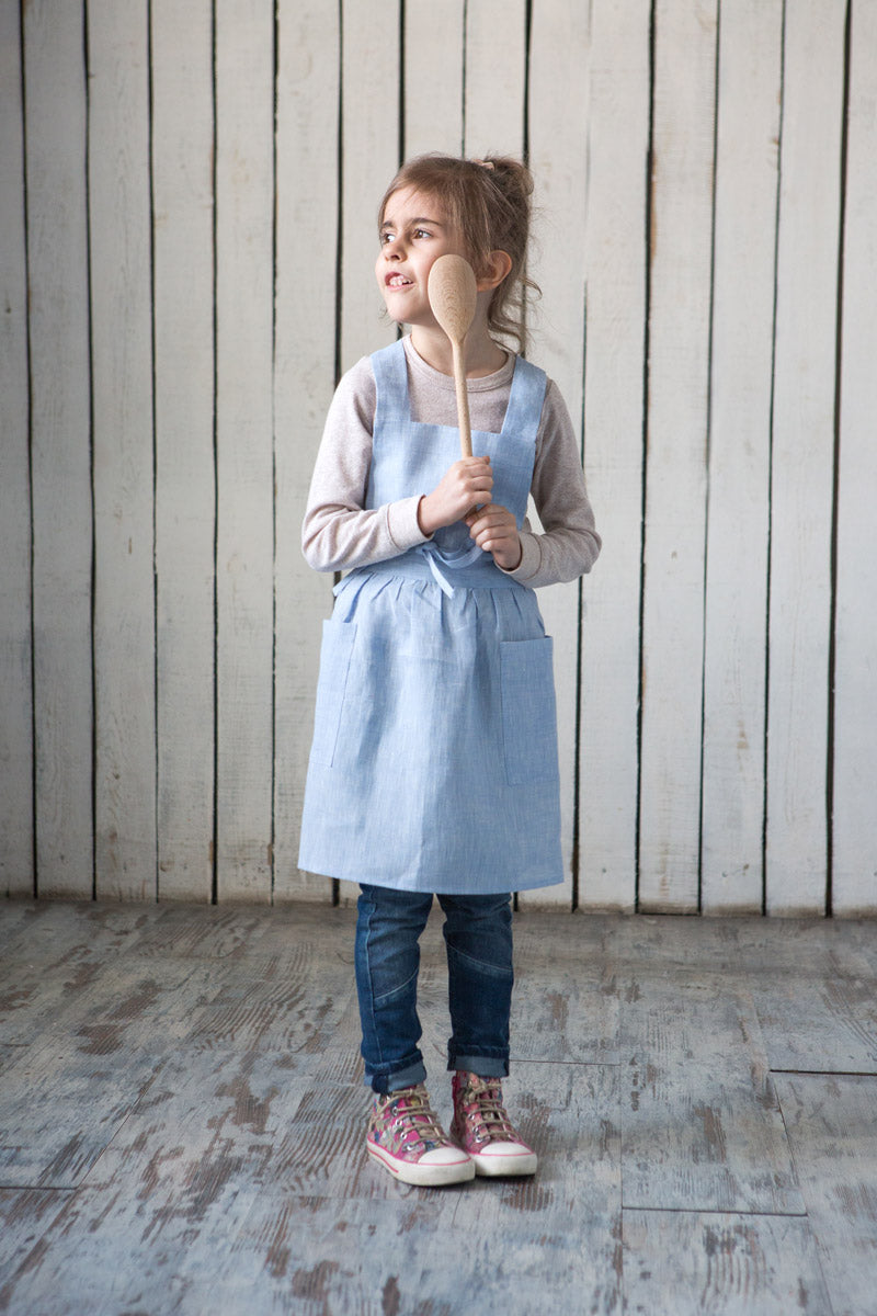Kids linen cross back apron, styled