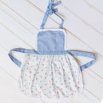 Maggie Blue toddler apron in printed cotton with lace trim