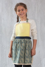 Tilly design kids apron worn by a girl