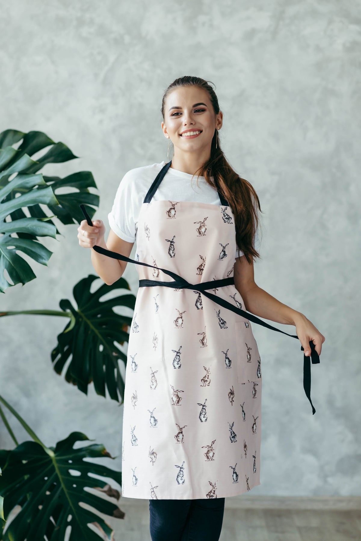 Bunny print kids apron in cotton canvas, front view