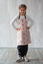 Bunny print apron for children, styled