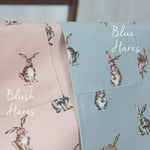 Cat print aprons worn by parent and child in the kitchen