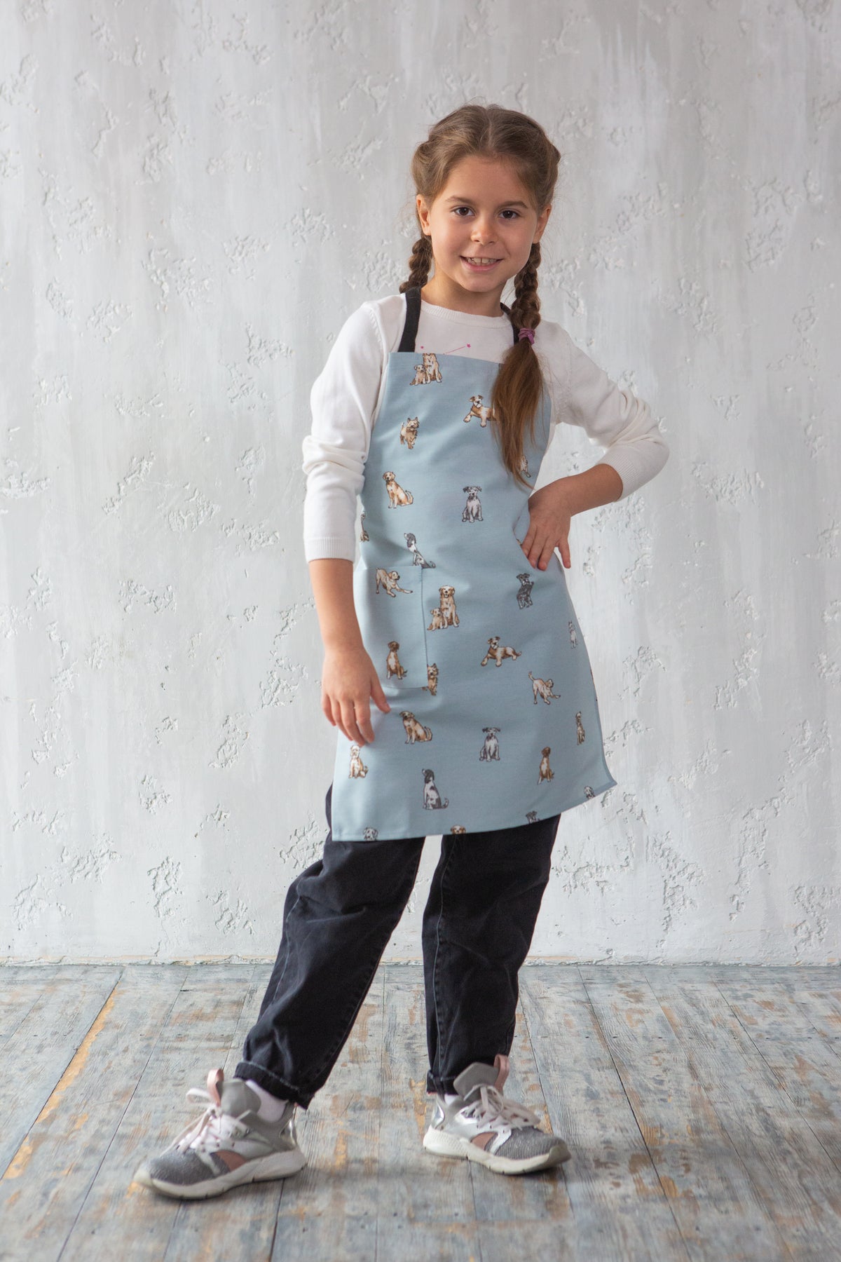 Dog print kids apron worn while baking