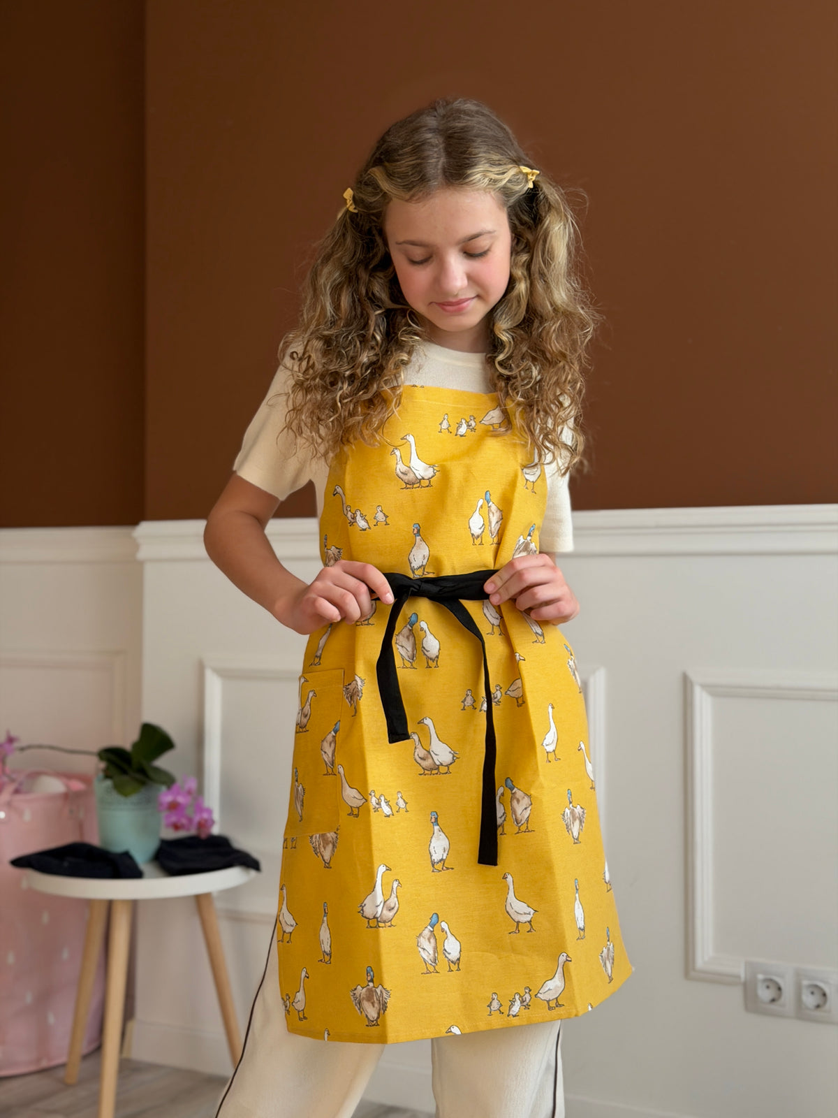 Duck print kids apron, back view showing ties