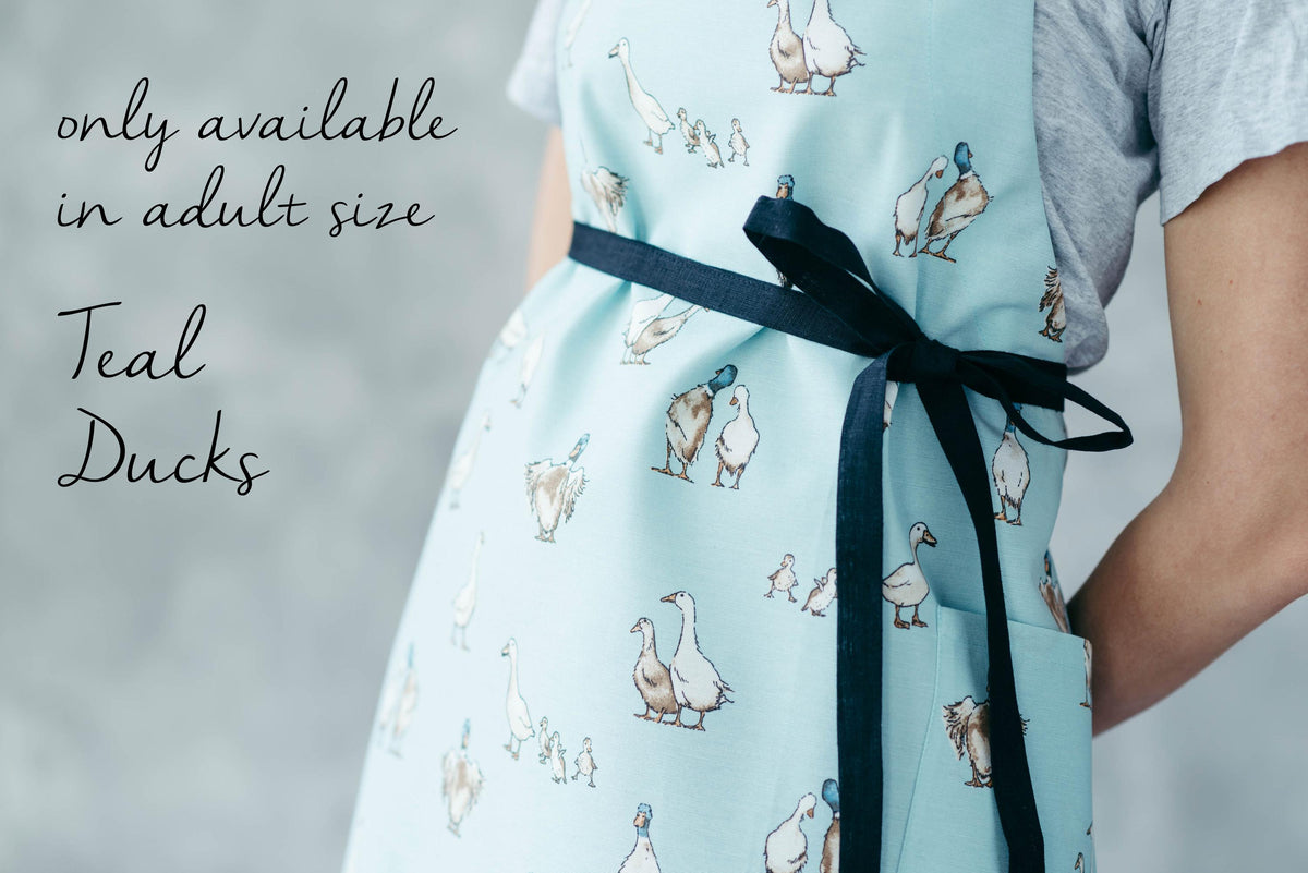 Duck print kids apron, full length on child