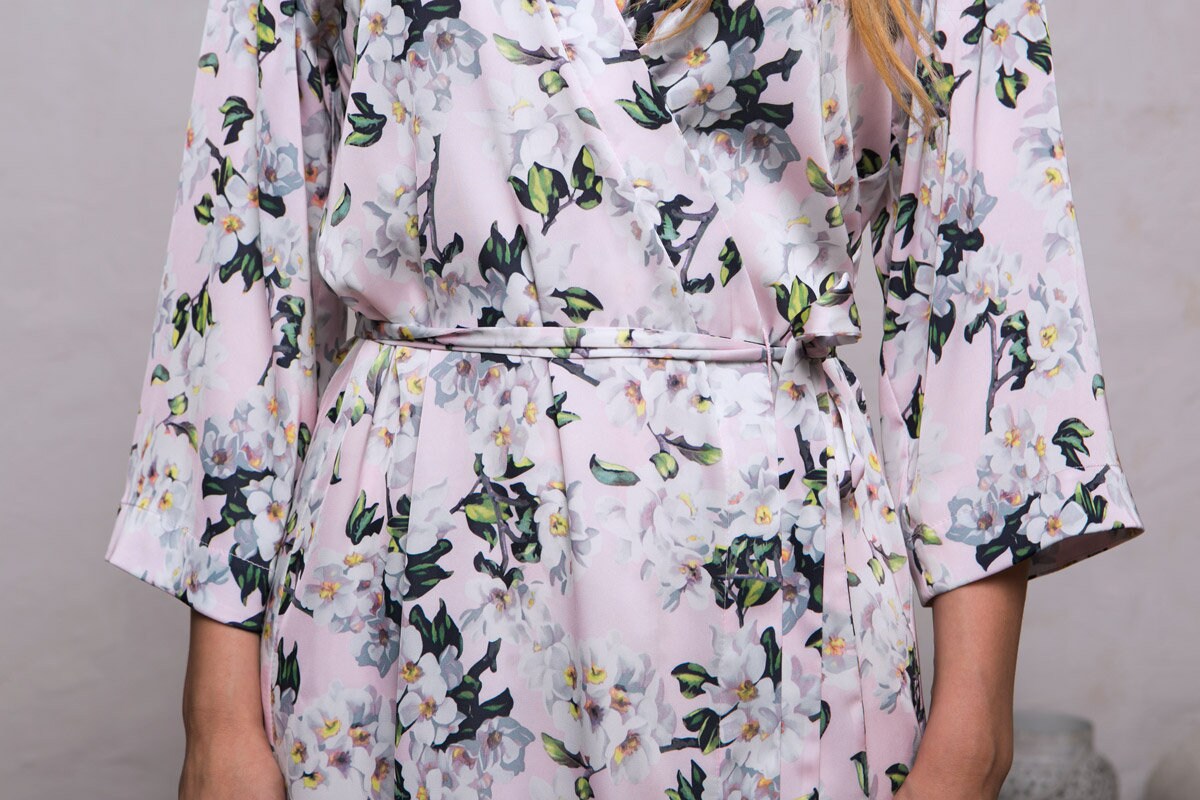 Floral satin robes worn by the bride and bridesmaids