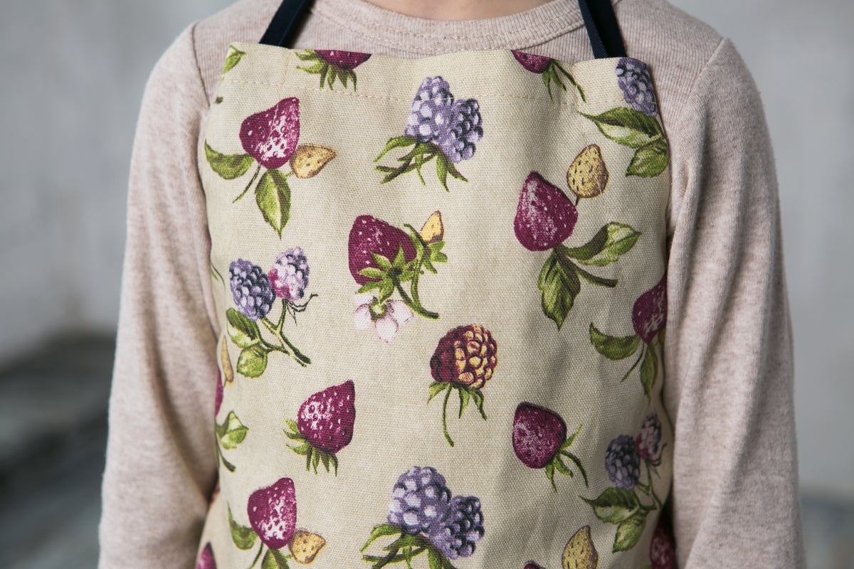 Kids chef apron with contrasting strap, styled