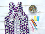 Purple floral cross back pinafore apron for girls