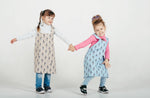Kids pinafore apron in a printed cotton colourway