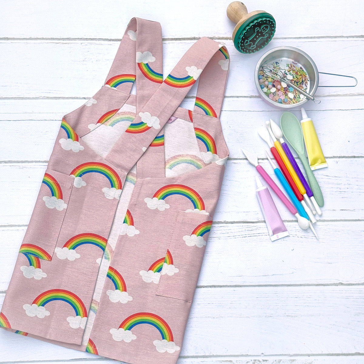 Pink rainbow cross back apron for children
