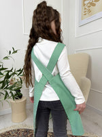 Green striped smock apron, pocket detail