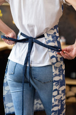 Nautical kitchen apron, fabric and stripe close view