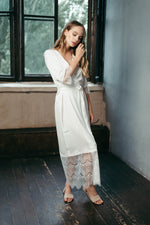Ivory satin bridal robe, belt tied at the waist