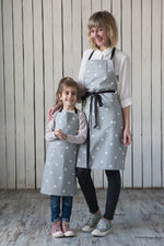 Toddler apron pocket detail in printed canvas