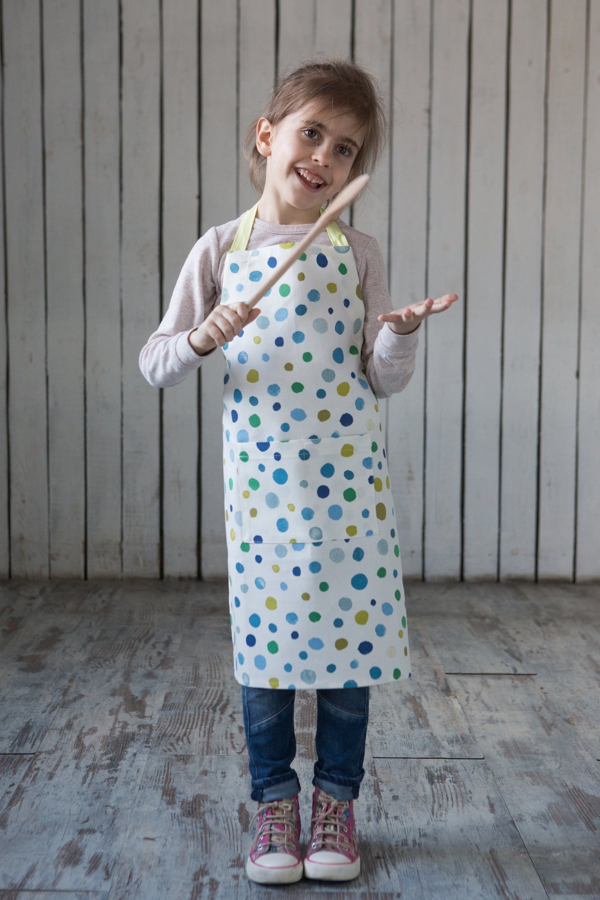 Unisex toddler apron, print and pocket detail