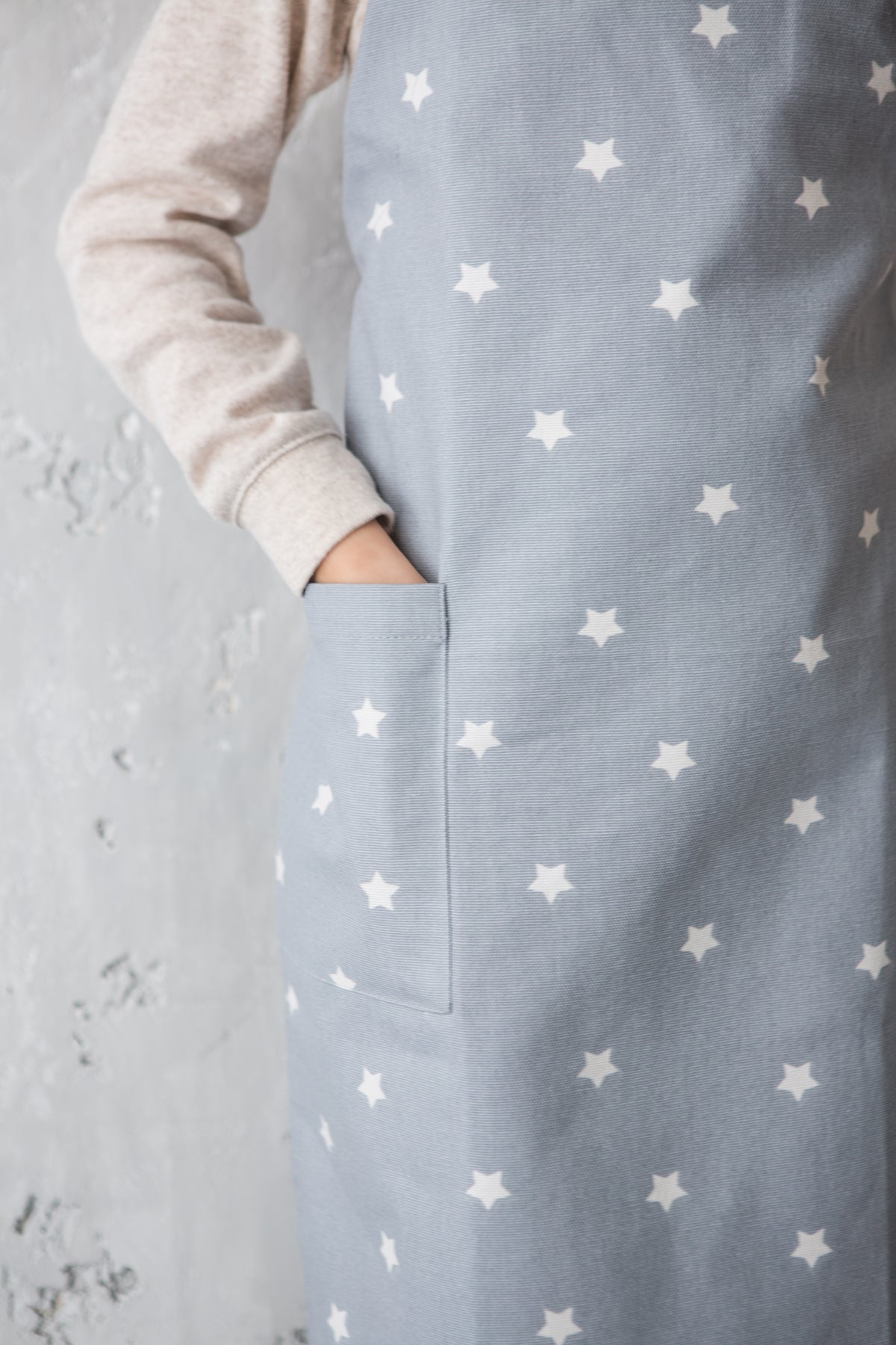 Toddler apron worn while baking, cotton canvas