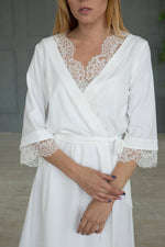 Lace dressing gown close-up, ivory satin trim