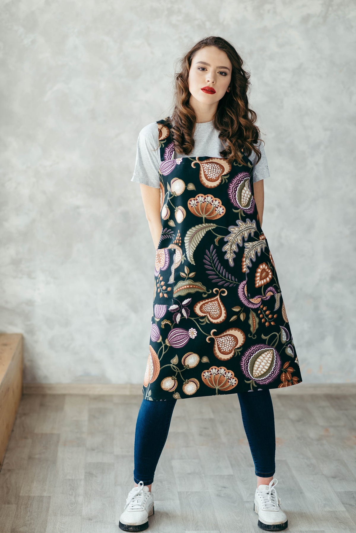 Pinafore apron styled on model, wine tapestry
