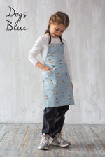 Dog print kids aprons in blue and blush