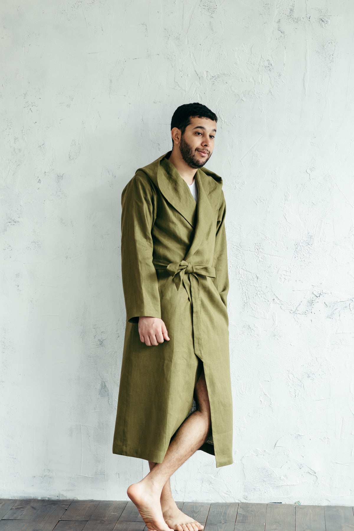 Man wearing a linen hooded robe after a swim