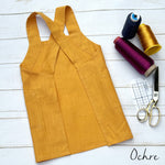 Personalised kids pinafore apron in yellow ochre