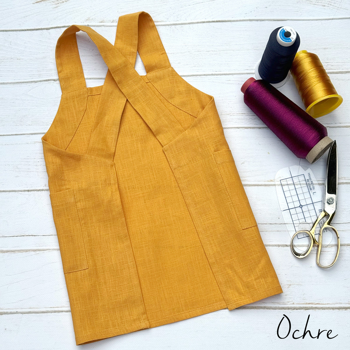 Personalised kids pinafore apron in yellow ochre