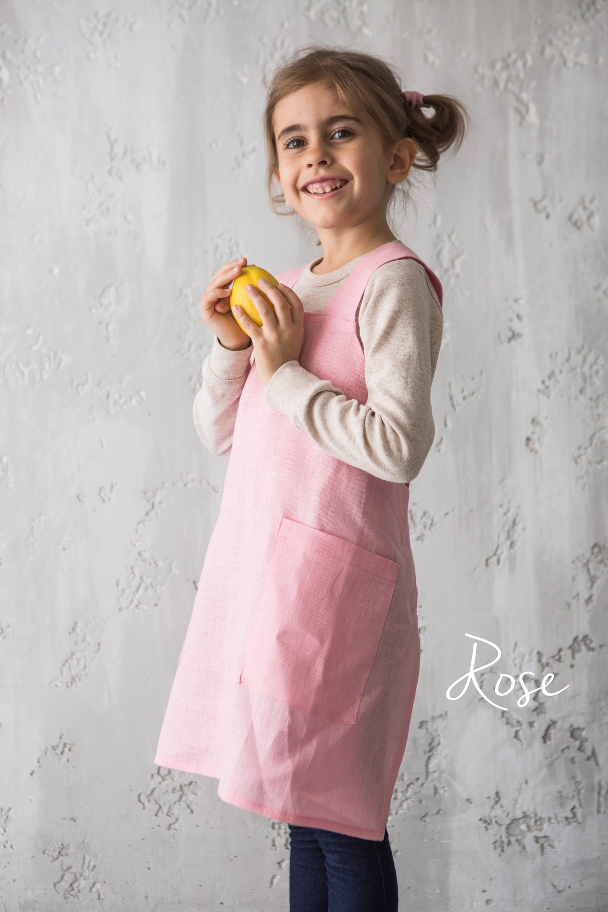 Kids cross back linen apron, styled